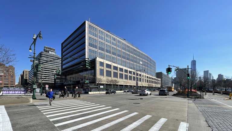 Speira’s aluminium façade of the St. John’s terminal surrounded by other buildings.