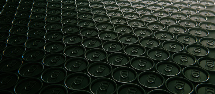 Tin cans’ tops stacked next to each other.