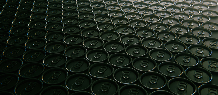 Tin cans’ tops stacked next to each other.