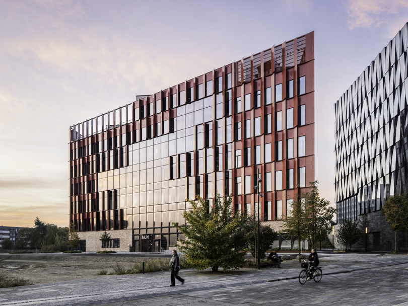 The red Speira aluminum façade of the Danish School of Media and Journalism.