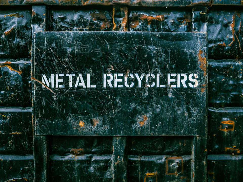 A Speira Recycling contaier with “Metal Recyclers” written on it.