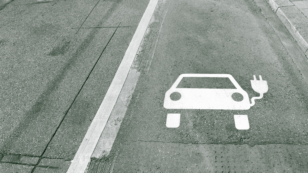 Road marking of a pictogram for an electric car.