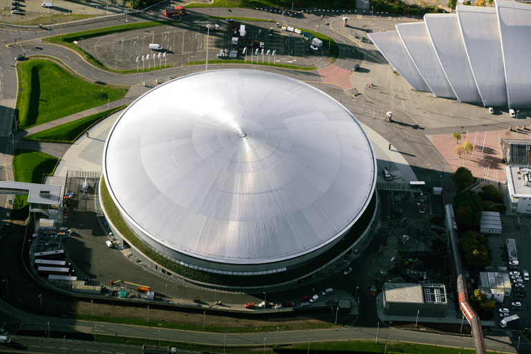 Round factory building with aluminum roof.