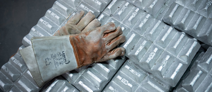 A Speira worker’s gloves lying on stacked-up pieces of aluminium.