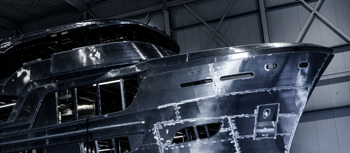 Hull of a ship during a production stage where you can see the aluminium components.
